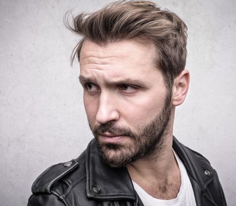 Haircut inspiration photo with styled hair and beard