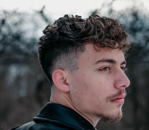Haircut inspiration photo with textured top and fade